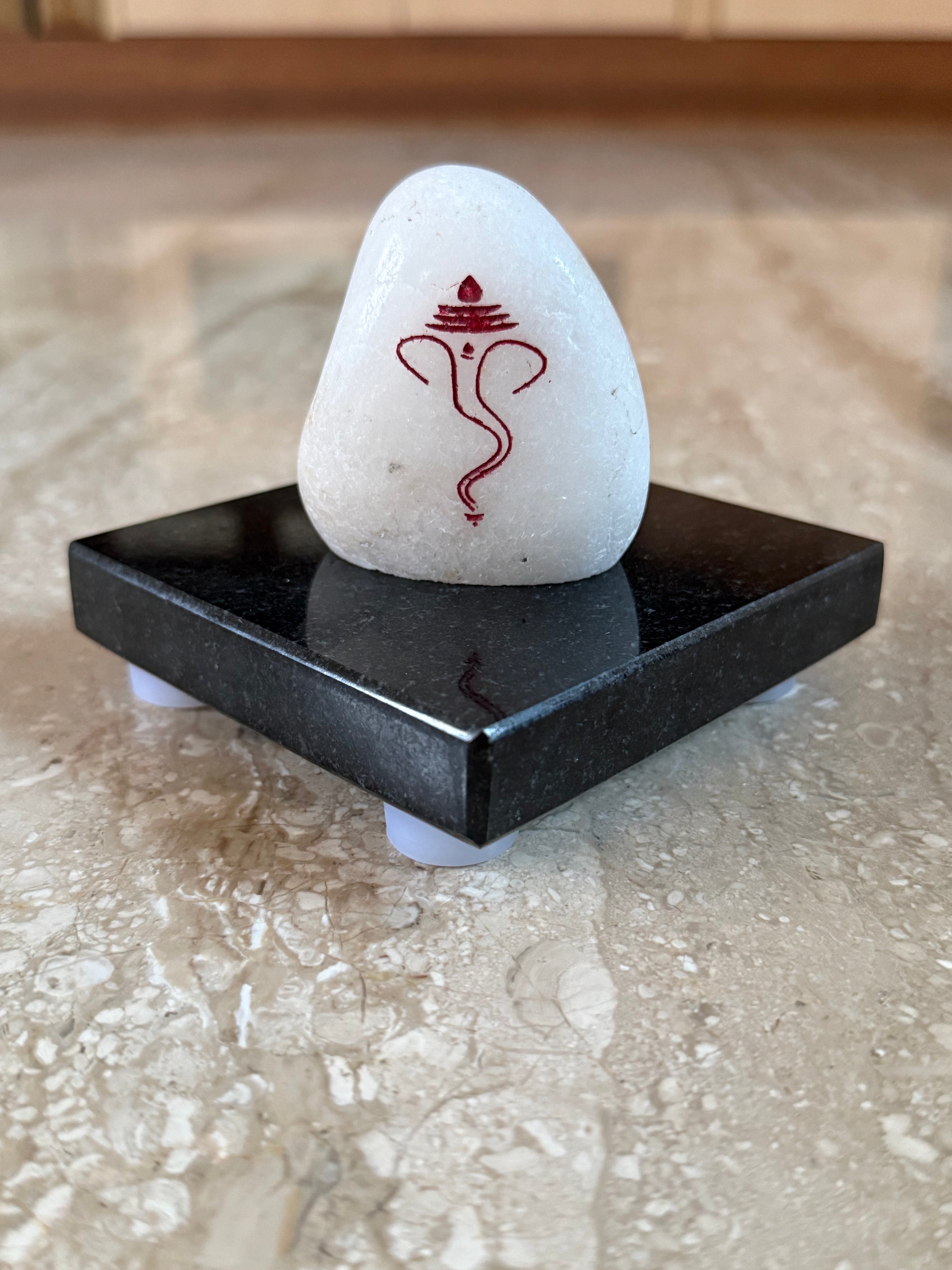 Ganesh marble engraving with jet black granite stand (Assorted size)
