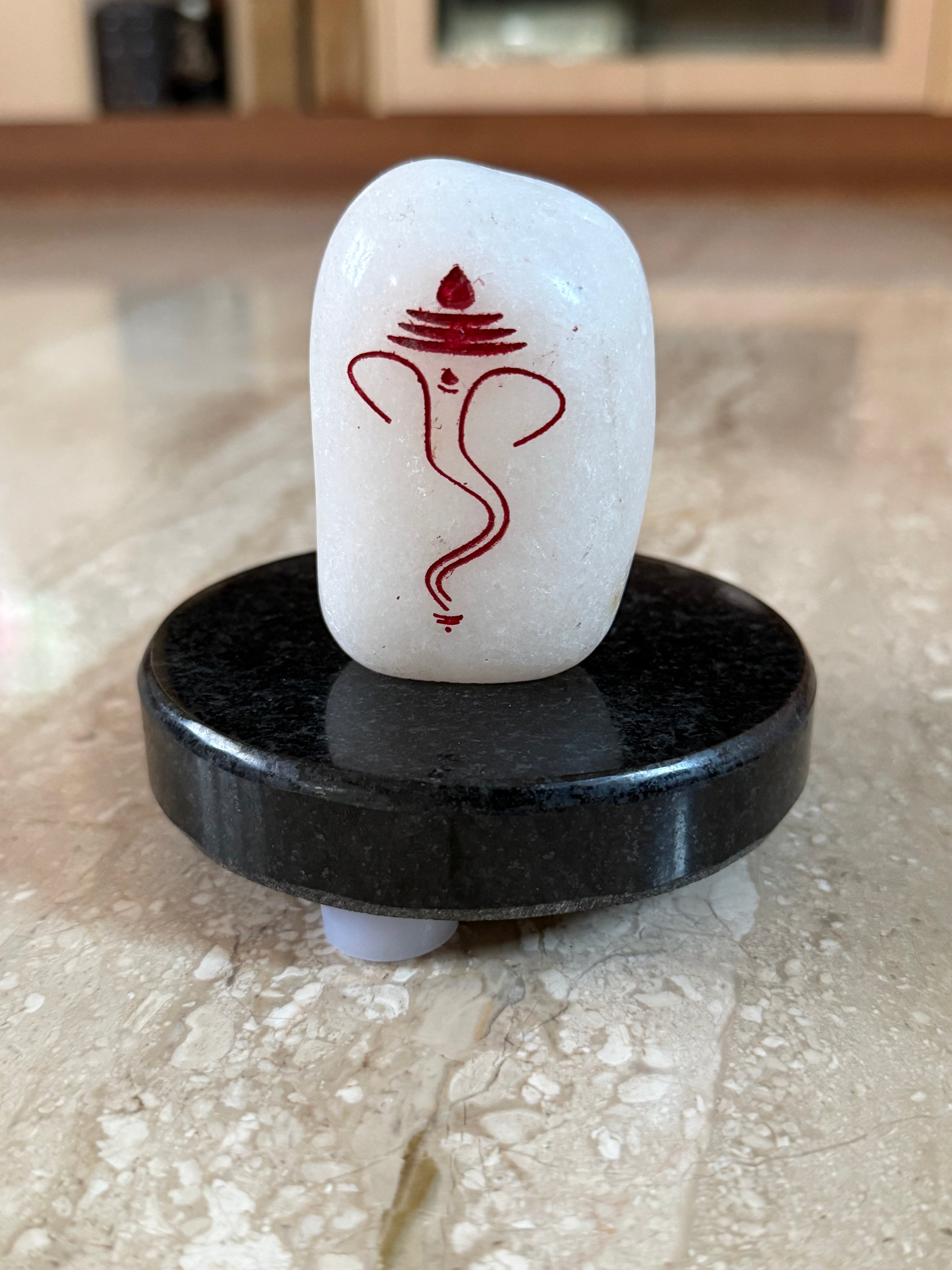 Ganesh marble engraving with jet black granite stand (Assorted size)